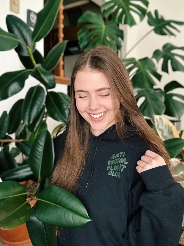 Happy Smiling Girl Posing with Rubber Tree at Home Garden Area