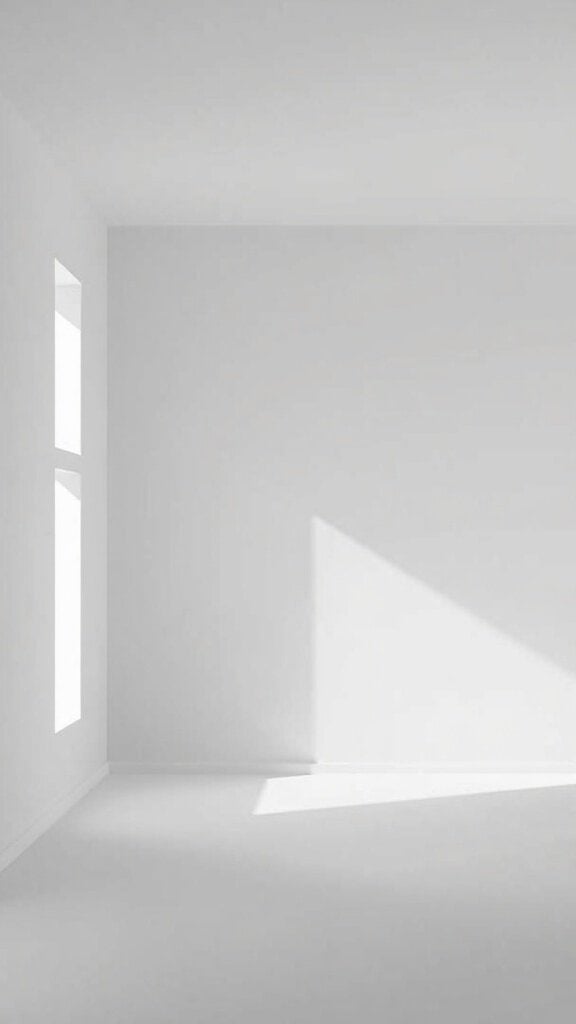 Bright empty room with white walls and floors